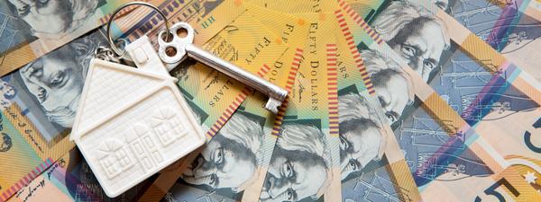 $50 Australian cash bank notes laid out for purchase of home.