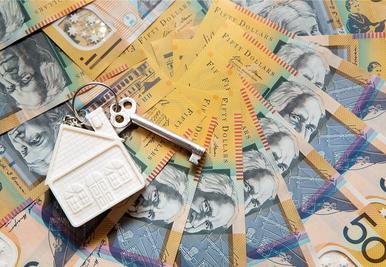 Multiple $50 cash notes laid out for cash property purchase